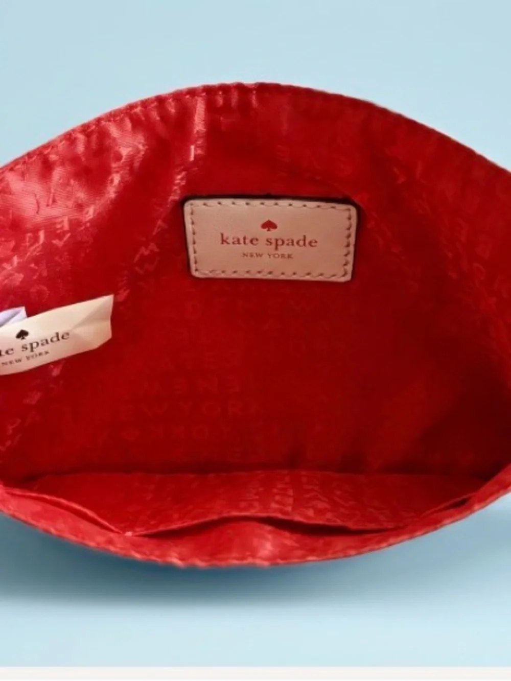 kate spade Cream Quilted Wristlet Clutch with Gold Logo
